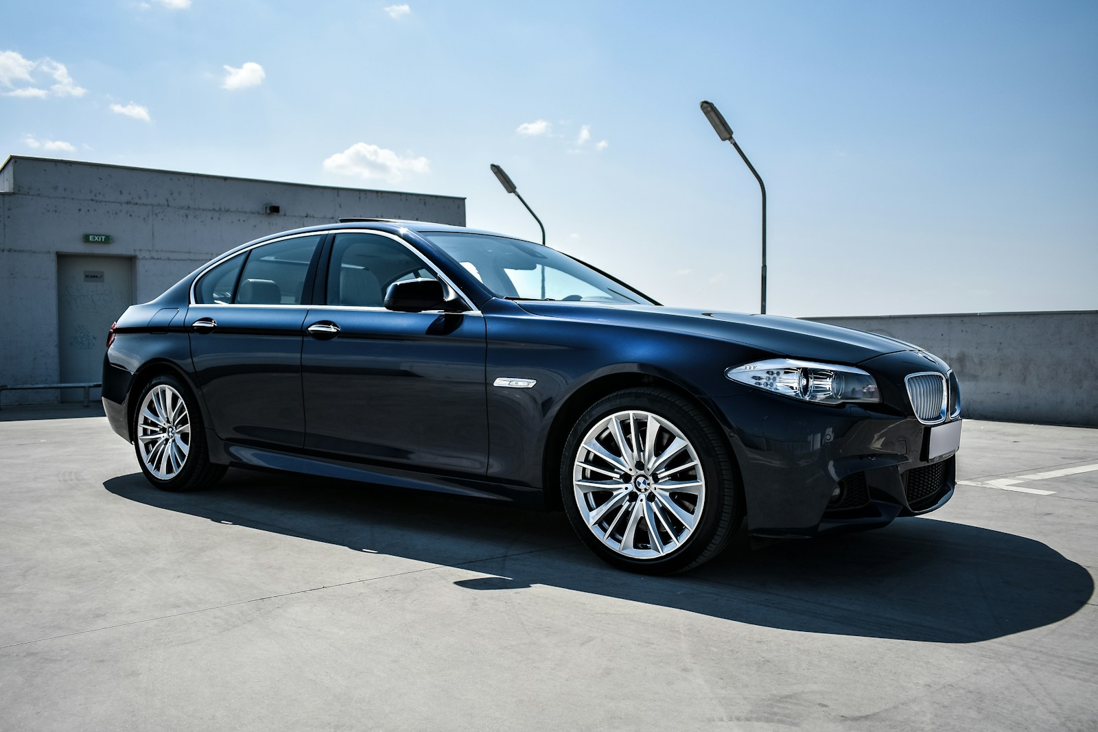 black BMW sedan on focus photography